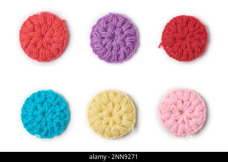knitted wool fabric abstract, pattern of colorful woven yarn round shaped isolated on white background, knitting and crafting concept, collection Stock Photo