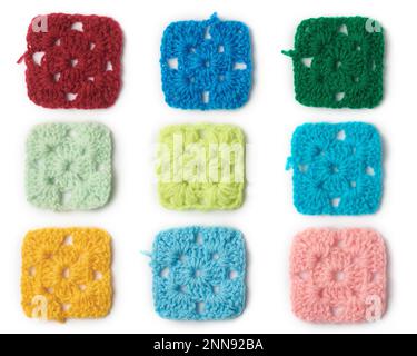 knitted wool fabric abstract, pattern of colorful woven yarn square shaped isolated on white background, knitting and crafting concept, collection Stock Photo