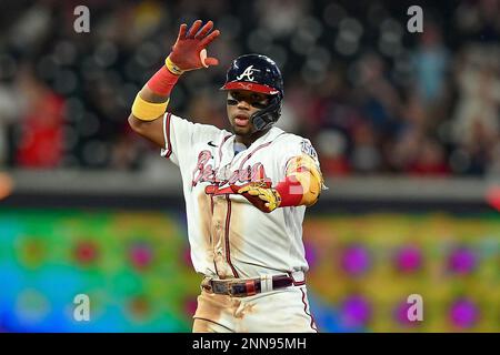 ATLANTA, GA - JULY 12: Atlanta Braves right fielder Ronald Acuna Jr. (13)  flips his bat after drawing a walk during an MLB game against the New York  Mets on July 12