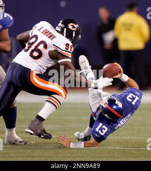 EAST RUTHERFORD - NOVEMBER 07: Giants QB #13 Kurt Warner drops