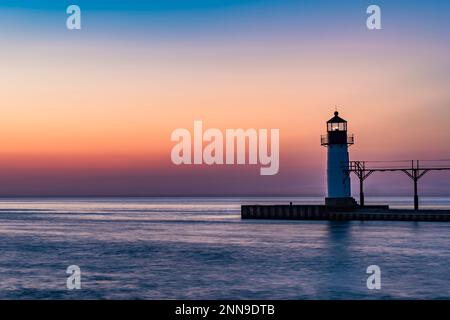St. Joseph North Pier Lighthouse on Lake Michigan at sunset, St. Joseph, Berrien Co., MI Stock Photo
