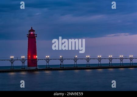 Grand Haven Lighthouse, South Pier, on Lake Michigan at sunset, Grand Haven, Ottawa Co., MI Stock Photo