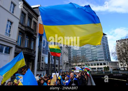 Brussels, Belgium. 25th Feb, 2023. Several thousand people take part in a demonstration for the first anniversary of the Russian invasion in Brussels, Belgium on Feb. 25, 2023. Credit: ALEXANDROS MICHAILIDIS/Alamy Live News Stock Photo