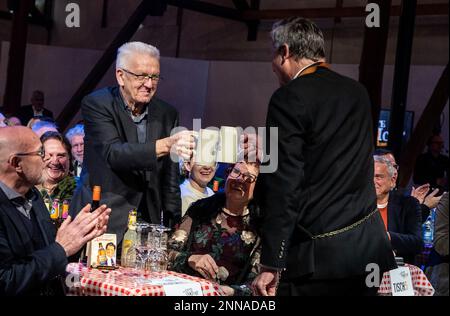 Fellbach, Germany. 25th Feb, 2023. Winfried Kretschmann (M, Bündnis 90/Die Grünen), Minister President of Baden-Württemberg, toasts with Hans-Ulrich Rülke, Chairman of the FDP/DVP parliamentary group in the state parliament of Baden-Württemberg, with a beer during the recording of the SWR program 'Das jüngste Gerü/icht mit Bruder Christophorus Sonntag'. The program will be broadcast on 26.02.2023 at 20.15. Credit: Christoph Schmidt/dpa/Alamy Live News Stock Photo