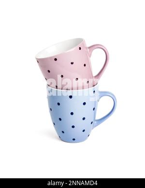 Pink and blue dotted mugs isolated on white background with clipping path Stock Photo