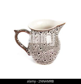 Glazed ceramic milk jar isolated on a white background Stock Photo