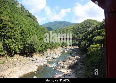 Hozugawa river viewed from Sagano romantic train in Kyoto, Japan Stock Photo