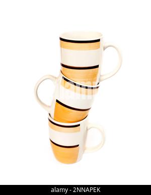 Stack of three mugs isolated on white background Stock Photo