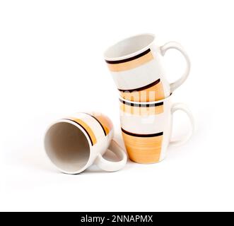 Stack of three mugs isolated on white background Stock Photo