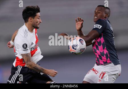 Rafinha of Brazil's Flamengo heads the ball challenged by Milton Casco of  Argentina's River Plate during the Copa Libertadores final soccer match at  the Monumental stadium in Lima, Peru, Saturday, Nov. 23