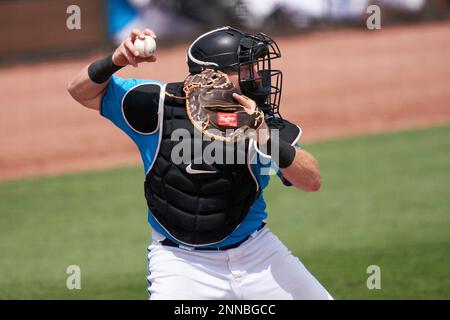 Miami Marlins catcher Chad Wallach (17) run drills during the