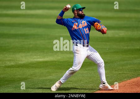 New York Mets shortstop Luis Guillorme, left, tags out Pittsburgh Pirates'  Connor Joe, right, on a steal-attempt at second base in the first inning in  a baseball game in Pittsburgh, Saturday, June