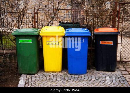 multi-colored plastic garbage containers for different garbage are on the street Stock Photo