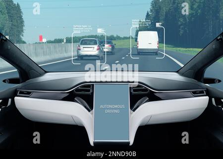 Self driving car on a road. Autonomous vehicle. Inside view. Stock Photo