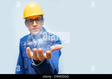 Development engineer holds in his hands a model of an electric transmission created in augmented reality. Stock Photo