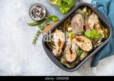 Healthy baked fish salmon steaks with basil green beans sweet