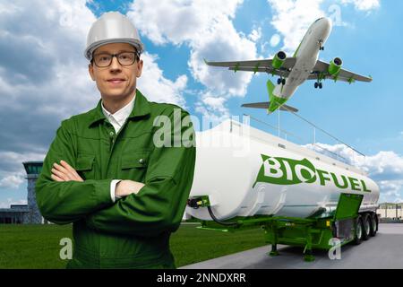 Engineer on a background of airplane and biofuel tank trailer. New energy sources Stock Photo