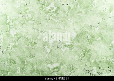 Light green textured surface with abstract marbled pattern, perfect for backgrounds and design projects. Stock Photo
