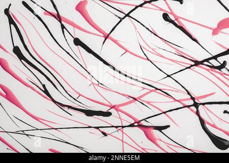 Thin pink and black lines and splashes on white background. Abstract art backdrop with paint brush strokes on canvas. Acrylic painting with graphic Stock Photo