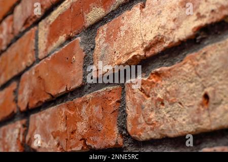 A red brick wall seen from an angle at home Stock Photo