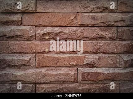 Brown clinker brick wall building. Old style brick wall texture background. Grunge dirty old rusty wall. Yellow and red bricks. Bright wall high resol Stock Photo