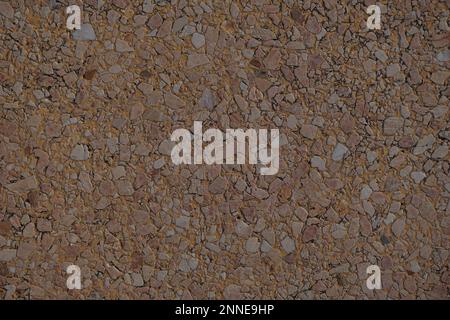 Grunge small dolomite crushed stone texture. Natural brown and beige colors stone background. High resolution seamless stone backdrop. Copy space for Stock Photo