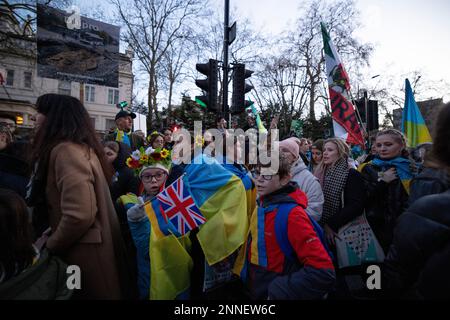 London, UK. 24th Feb, 2023. Ukrainians and their supporters are seen arriving at the rally at Embassy of Russia in London. Thousands of Ukrainians and their supporters gathered at the Embassy of Russia in London for a rally in memorial of the 1st year anniversary of the Russia-Ukraine War. Russia has started the invasion to Ukraine with bombing to the major cities at 5am on 24th February 2022. Credit: SOPA Images Limited/Alamy Live News Stock Photo