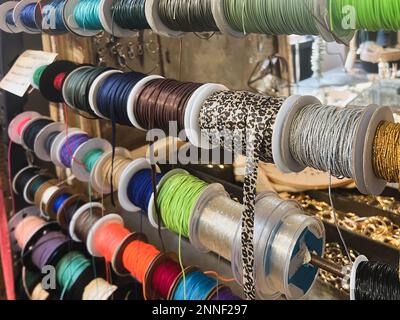 Reels of ribbons hanging in the store Stock Photo