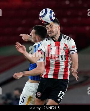 April 24, 2021, Sheffield, United Kingdom: Sheffield, England, 24th April 2021. John Egan of Sheffield Utd tussles with Lewis Dunk of Brighton during the Premier League match at Bramall Lane, Sheffield. Picture credit should read: Andrew Yates / Sportimage(Credit Image: © Andrew Yates/CSM via ZUMA Wire) (Cal Sport Media via AP Images)