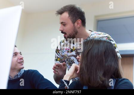 Young people in programming school.Students Learning In A Programing Class Stock Photo