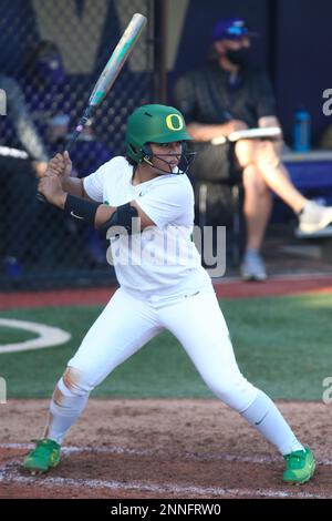 SEATTLE, WA - APRIL 17: Oregon Ducks catcher Terra McGowan (11) throws the  ball to first during a college softball game between the Oregon Ducks and  the Washington Huskies on April 17