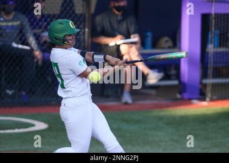 SEATTLE, WA - APRIL 17: Oregon Ducks catcher Terra McGowan (11) throws the  ball to first during a college softball game between the Oregon Ducks and  the Washington Huskies on April 17