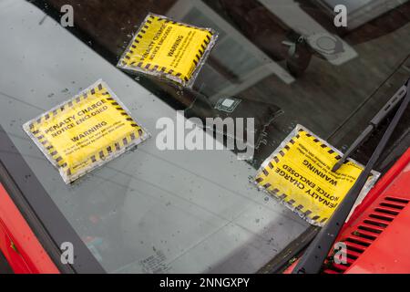 Three parking tickets on the windscreen of a car in the city of Durham, UK Stock Photo