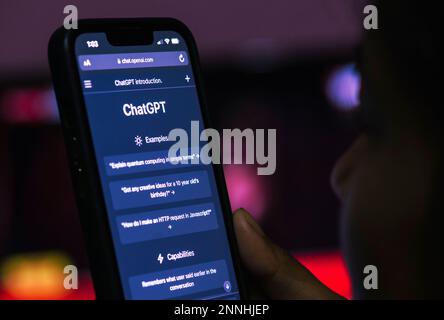 February 23, 2023: In this photo illustration, a person browses ChatGPT, a chatbot launched by OpenAI, on a smartphone, on February 23, 2023 in Guwahati, India. ChatGPT is a popular artificial intelligence chatbot, which has reached over 100 million users in two months after launch. (Credit Image: © David Talukdar/ZUMA Press Wire) EDITORIAL USAGE ONLY! Not for Commercial USAGE! Stock Photo