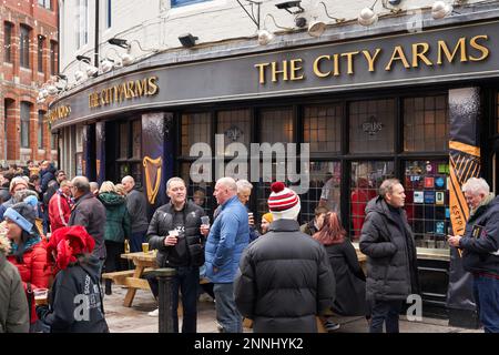 Drinkers and rugby fans outside The City Arms on Quay Street, Cardiff on the Wales vs England match day, February 2023 Stock Photo