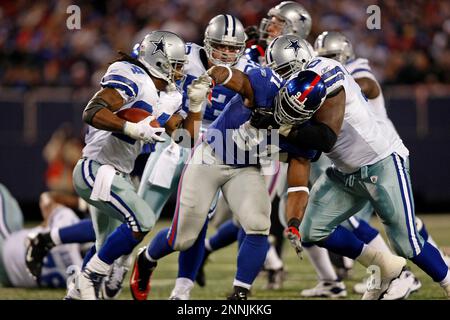 02 November 2008 - Marion Barber III (24) of the Dallas Cowboys runs away  from Justin Tuck (91) of the New York Giants during the Giants 35-14 win  over the Cowboys at