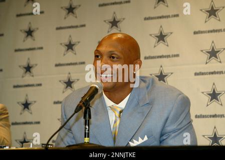 Dallas Cowboys running back Eddie George, carrying ball, prepares to run  through the gauntlet during drills on the first day of training camp  Saturday, July 31, 2004, in Oxnard, Calif. (AP Photo/Tony