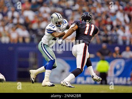 16 August 2008 - Adam Jones (21) of the Dallas Cowboys returns a punt  during the Cowboys preseason game with the Denver Broncos at Invesco Field  at Mile High Stadium in Denver