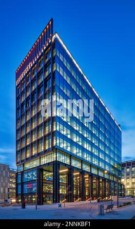 External view of The Spark at dusk on Newcastle Helix, Newcastle upon Tyne, England, United Kingdom with all the floorspaces lit up inside Stock Photo