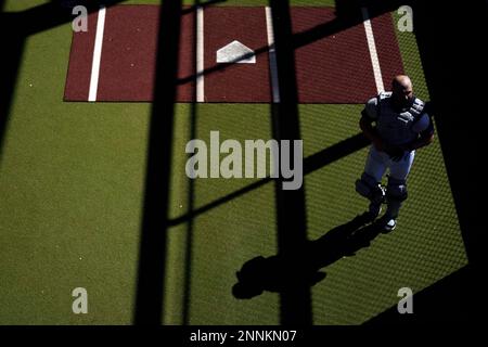 Atlanta Braves bullpen catcher Jimmy Leo (97) warms up before a