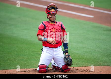 JUPITER, FL - MARCH 20: St. Louis Cardinals non-roster invitee infielder  Jose Rondon (64) scores a run after being batted in by St. Louis Cardinals  outfielder Lane Thomas (not shown) during an