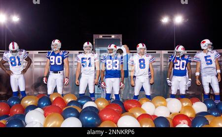 30 July 2009: Wide Reciever Terrell Owens of the Buffalo Bills unveils the  new throwback uniforms after the Bills Thursday night practice at St. John  Fisher College in Pittsford, New York. (Icon