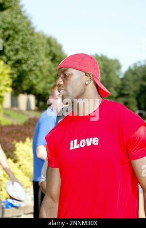 30 July 2009: Wide Reciever Terrell Owens of the Buffalo Bills unveils the  new throwback uniforms after the Bills Thursday night practice at St. John  Fisher College in Pittsford, New York. (Icon