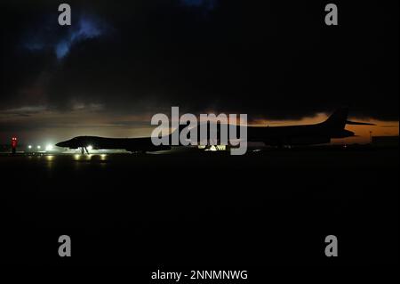 U.S. Airman 1st Class Andre Monterrosa, 34th Expeditionary Bomb Squadron crew chief, marshals a B-1B Lancer, assigned to the 34th EBS, after landing at Andersen Air Force Base, Guam, in support of a Bomber Task Force mission, Feb. 21, 2023. U.S. forces will fly, sail, and operate anywhere international law allows, at the time and tempo of their choosing. (U.S. Air Force photo by Staff Sgt. Ericka A. Woolever) Stock Photo