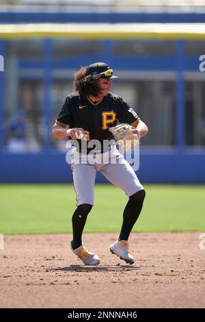 Cole Tucker of the Pittsburgh Pirates throws to first base to