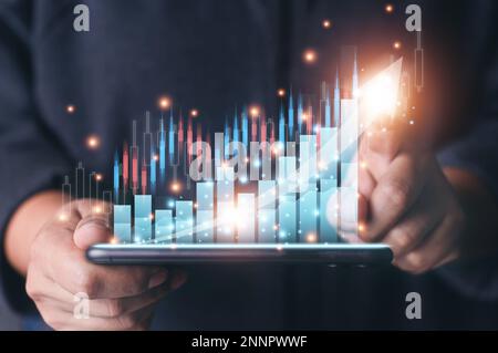 Business man point plan growth increase of positive indicators graph in his business. Planning of business, Graph growth success concept. Stock market Stock Photo