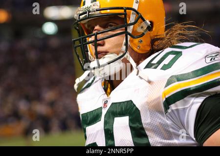 30 November 2008: Green Bay Packers quarterback Aaron Rodgers (12) hands  off the football in the first quarter at Lambeau Field in Green Bay,  Wisconsin. The Panthers defeated the Packers 35-31. (Icon