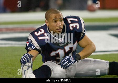 New England Patriots safety Rodney Harrison is dressed for the cold as he  stands on the stadium field as practice begins at the NFL football team's  facility in Foxborough, Mass., Thursday afternoon