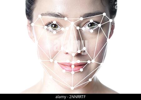 face detection or facial recognition grid overlay on face of young beautiful woman - artificial intelligence or identity or technology concept Stock Photo