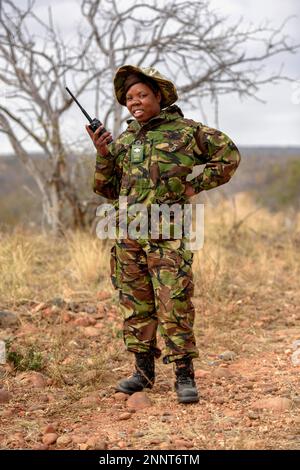 Ranger of the anti-poacher unit Black Mambas with Funfgeraet, Balule Game Reserve, Limpopo Province, South Africa Stock Photo
